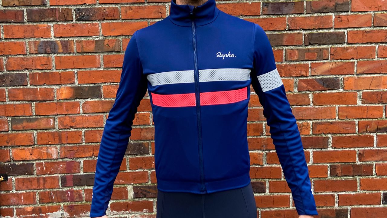 Image shows a rider wearing the Rapha Men&#039;s Brevet Insulated Long Sleeve Gore-Tex Infinium Jersey