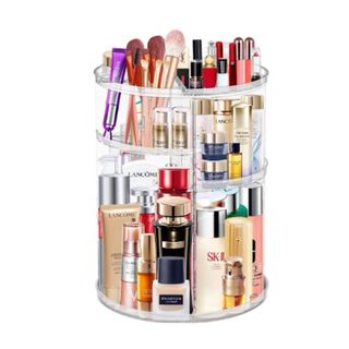 A plastic makeup organizer with colorful makeup products on it