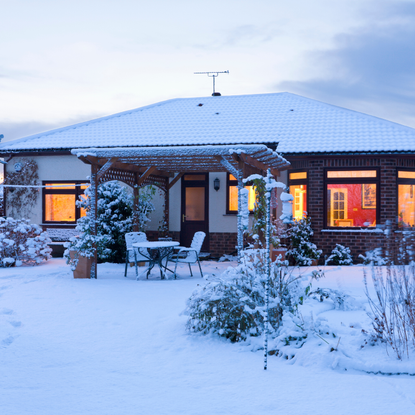 Back garden of bungalow in winter snow, Wirral, Merseyside