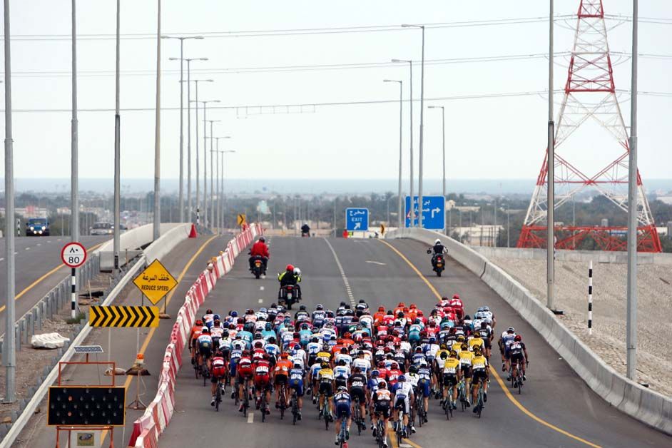 The group uses the full width of the road
