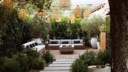 A fairylight canopy over a backyard