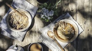 Bowls of oatmeal set out on a picnic table