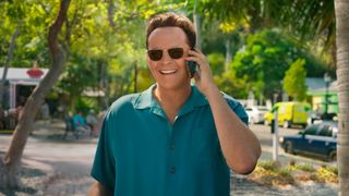 Vince Vaughn wears sunglasses while on the phone