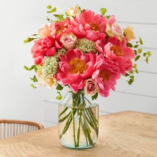 peonies floral bouquets with glass vase