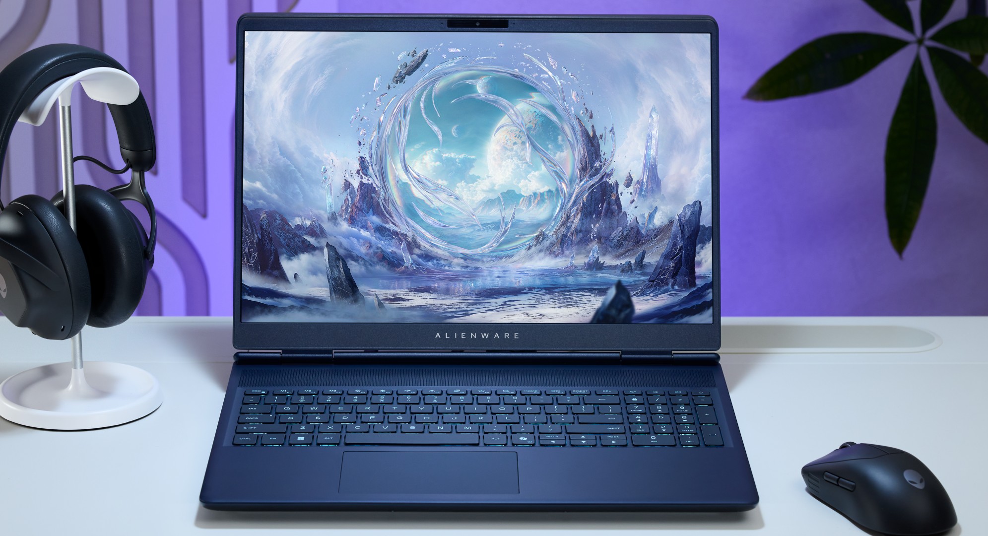 Alienware Aurora 16X gaming laptop on a white desk with a headset and mouse