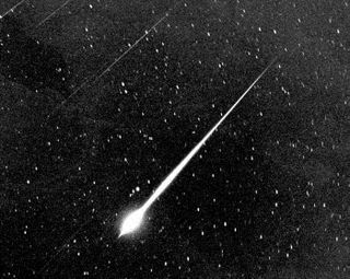 A fireball spawned by the Leonid meteor shower takes center stage in this NASA handout. 