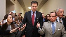 WASHINGTON, DC - DECEMBER 07: Former Federal Bureau of Investigation Director James Comey is surrounded by reporters after testifying to the House Judiciary and Oversight and Government Reform committees at the Rayburn House Office Building on Capitol Hill December 07, 2018 in Washington, DC. With less than a month of control of the committees, House Republicans subpoenaed Comey to testify behind closed doors about investigations into Hillary Clinton&rsquo;s email server and whether President Trump&rsquo;s campaign advisers colluded with the Russian government to steer the outcome of the 2016 presidential election. (Photo by Chip Somodevilla/Getty Images)