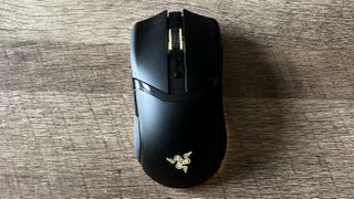 Razer Cobra Pro mouse on a wooden background