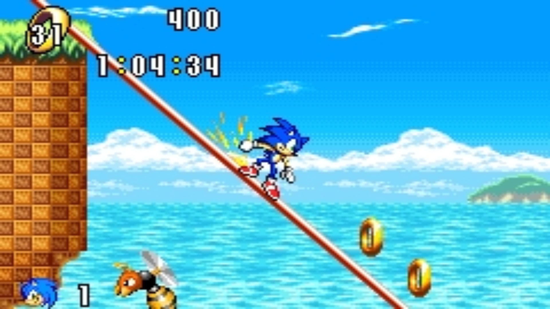 Sonic Advance screenshot of Sonic grinding down a beam towards some gold rings