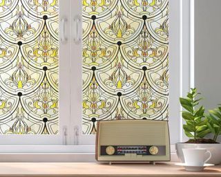 Window with yellow floral stained glass pattern