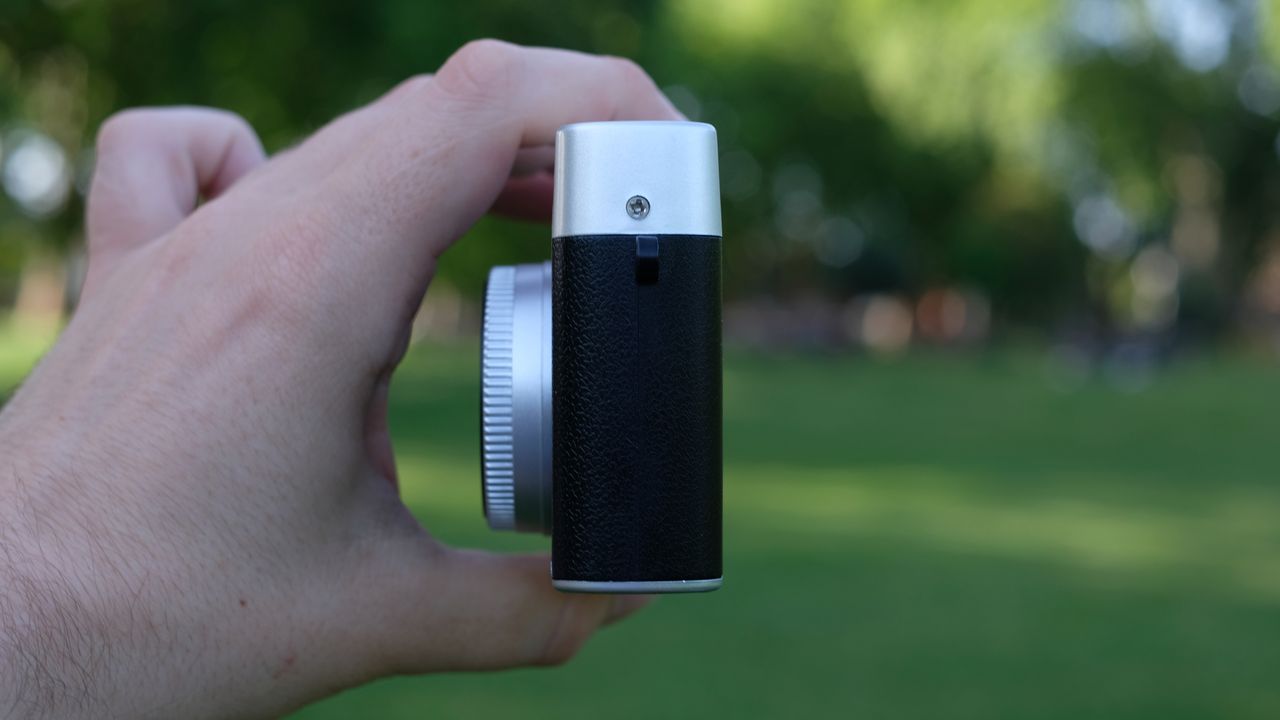 Photograph of Camp Snap CS-Pro digital compact camera held in side profile facing left