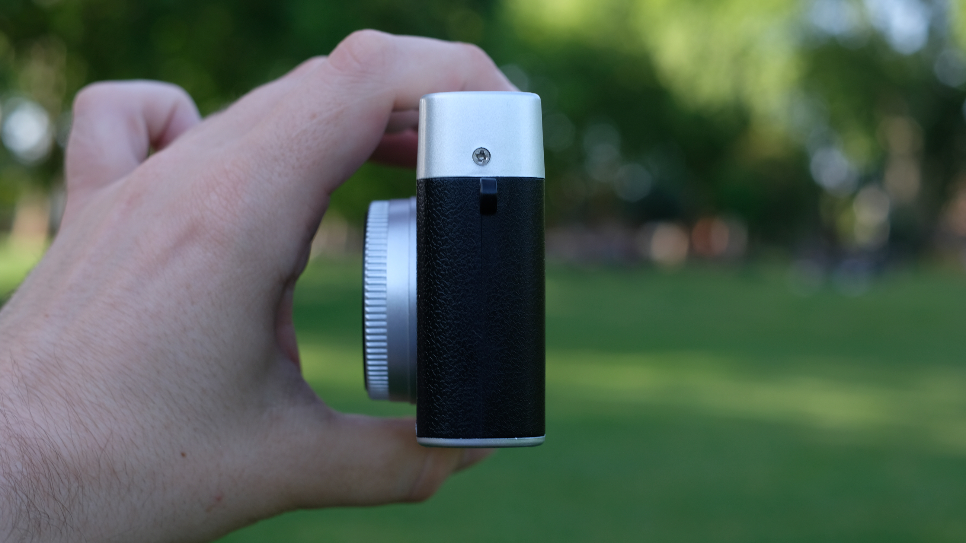 Photograph of Camp Snap CS-Pro digital compact camera held in side profile facing left