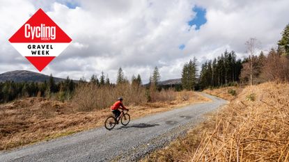 A lone gravel rider on a trail in Scotland