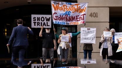 Protesters outside hearing to charge former FBI Director James Comey