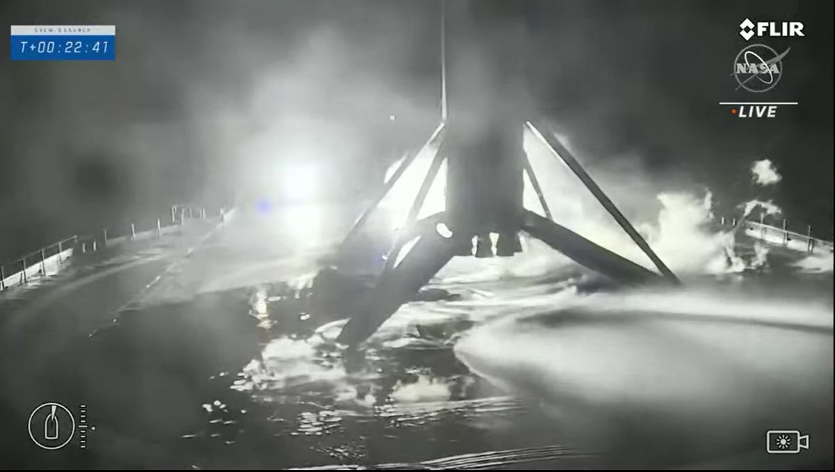 The SpaceX Falcon 9 rocket first stage used to launch NASA's Crew-3 mission to the International Space Station stands atop its drone ship landing platform in the Atlantic Ocean after a successful launch on Nov. 10, 2021.