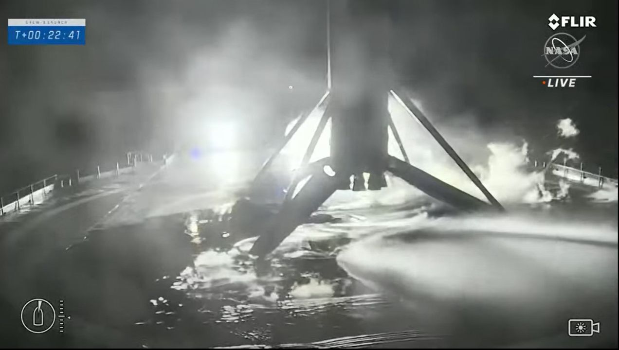 The SpaceX Falcon 9 rocket first stage used to launch NASA's Crew-3 mission to the International Space Station stands atop its drone ship landing platform in the Atlantic Ocean after a successful launch on Nov. 10, 2021.