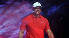 Tiger Woods pictured walking out into the stadium to play in TGL