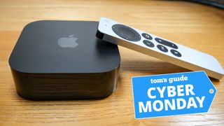 The Apple TV 4K and remote with a Tom's Guide Cyber Monday logo