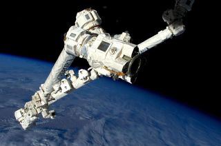 A view of the Canadarm2 robotic arm, with a latching end effector in the foreground, after releasing a SpaceX Dragon cargo capsule from the International Space Station in 2015.