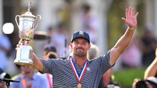 Bryson DeChambeau acknowledges the crowd after being presented with the US Open trophy