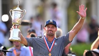 Bryson DeChambeau acknowledges the crowd after being presented with the US Open trophy