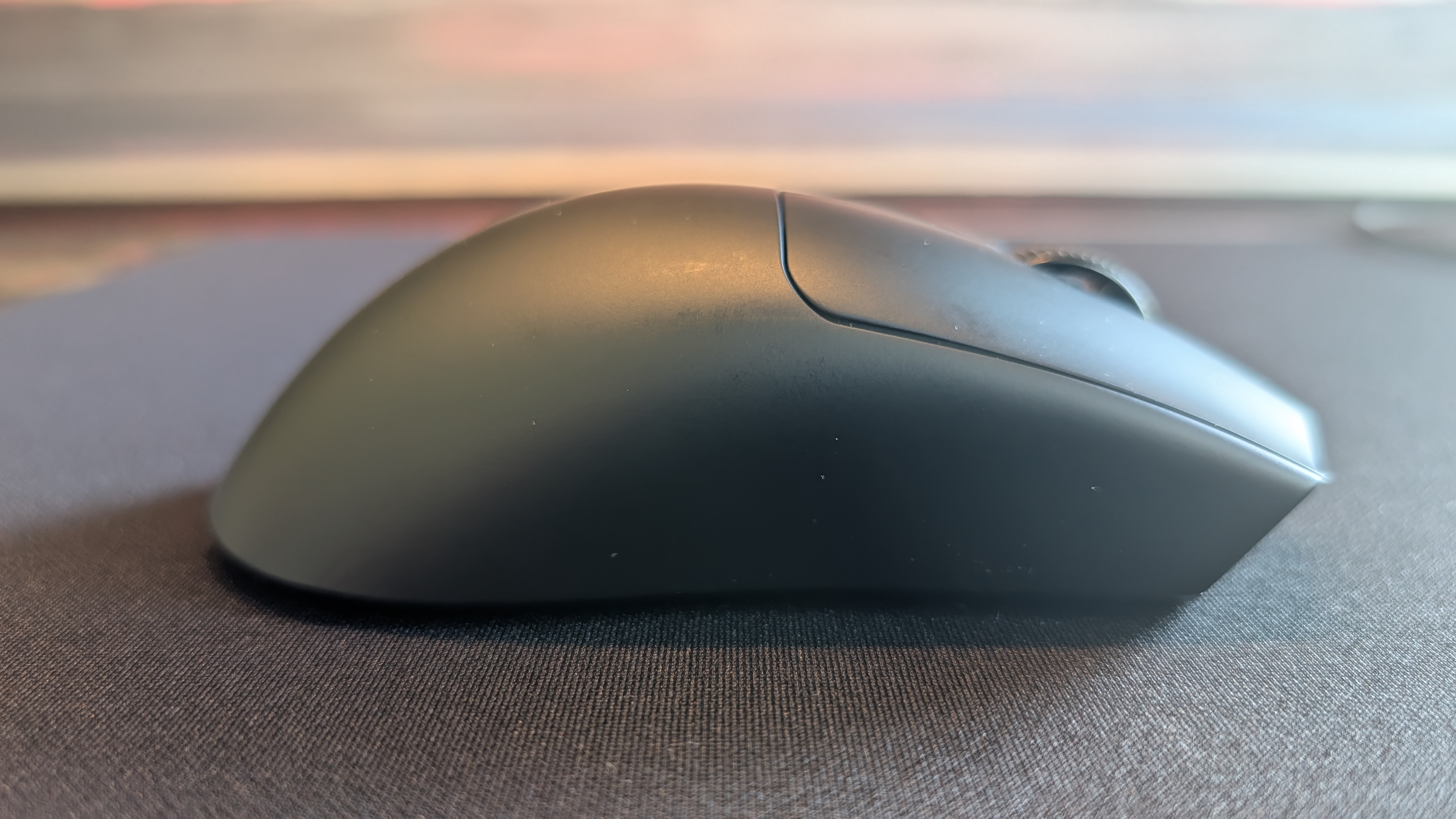 The Razer Viper V4 Pro gaming mouse pictured on the Razer Gigantus V2 Pro mouse mat.