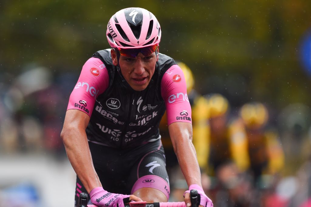 Team Deceuninck rider Portugals Joao Almeida wearing the overall leaders pink jersey crosses the line during the 9th stage of the Giro dItalia 2020 cycling race a 208kilometer route between San Salvo and Roccaraso on October 11 2020 Photo by DARIO BELINGHERI AFP Photo by DARIO BELINGHERIAFP via Getty Images