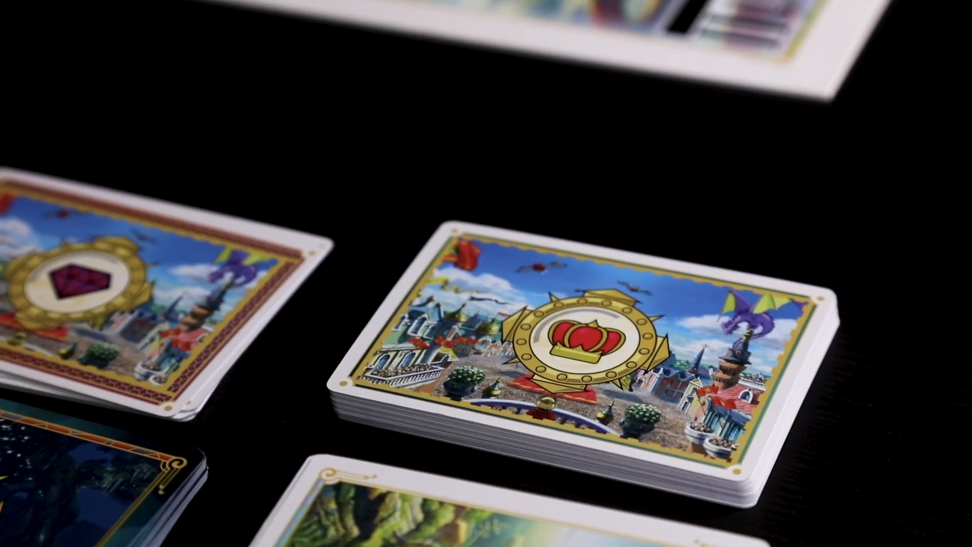Ni No Kuni 2: The Board Game cards and components laid out on a dark surface