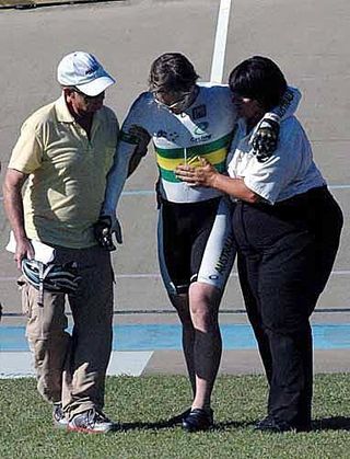 Ryan Bayley is escorted off the track after falling heavily at the Rockhampton Cup on Wheels.