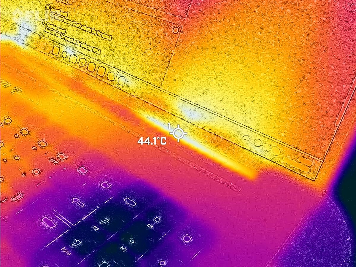 Razer Blade 18 (2025) gaming laptop viewed with a FLIR thermal camera showing hot and cool spots