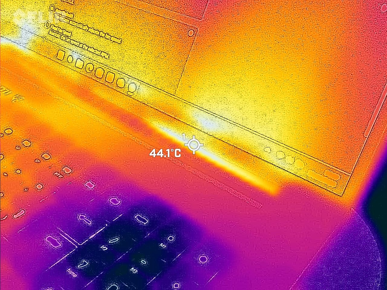 Razer Blade 18 (2025) gaming laptop viewed with a FLIR thermal camera showing hot and cool spots