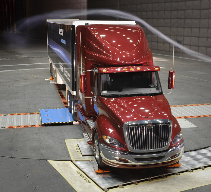 Streaklines appear during a smoke test of semi-trailer aerodynamics in a wind tunnel.