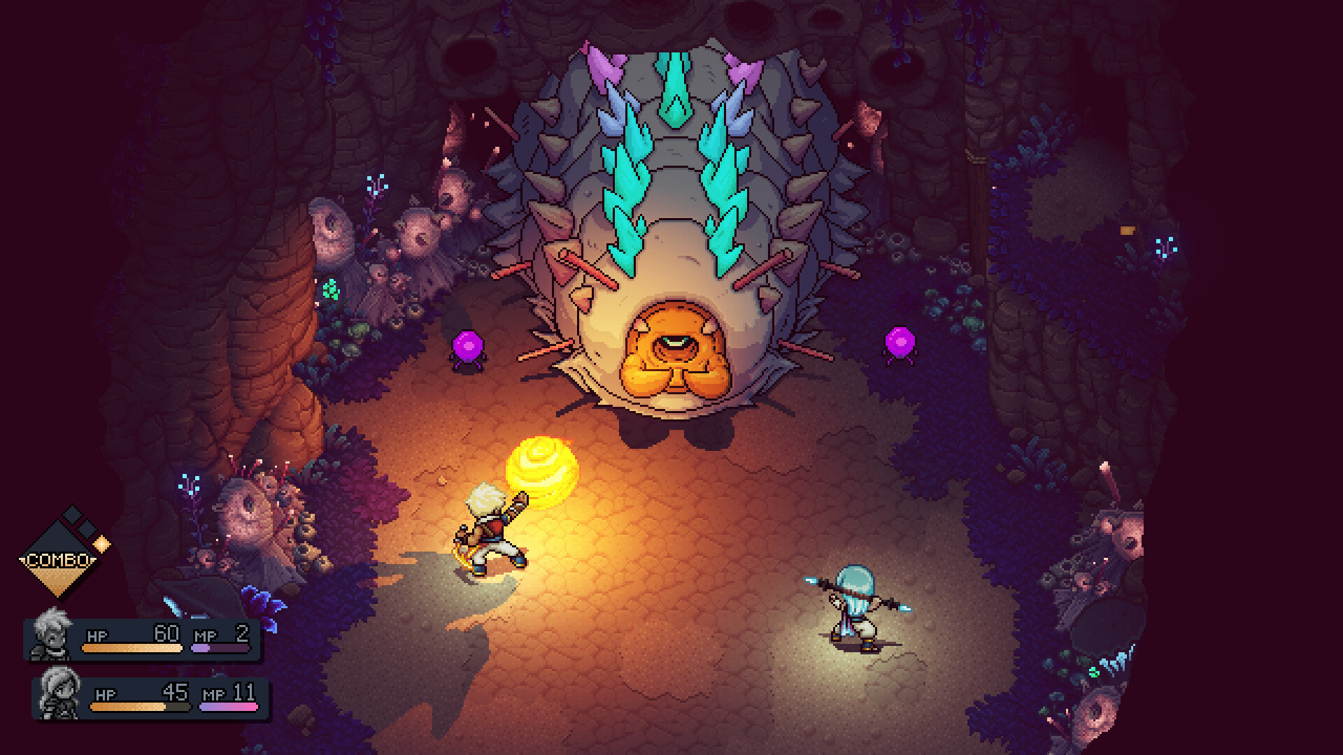 Two players fighting a massive worm in a cave together during the RPG Sea of Stars.
