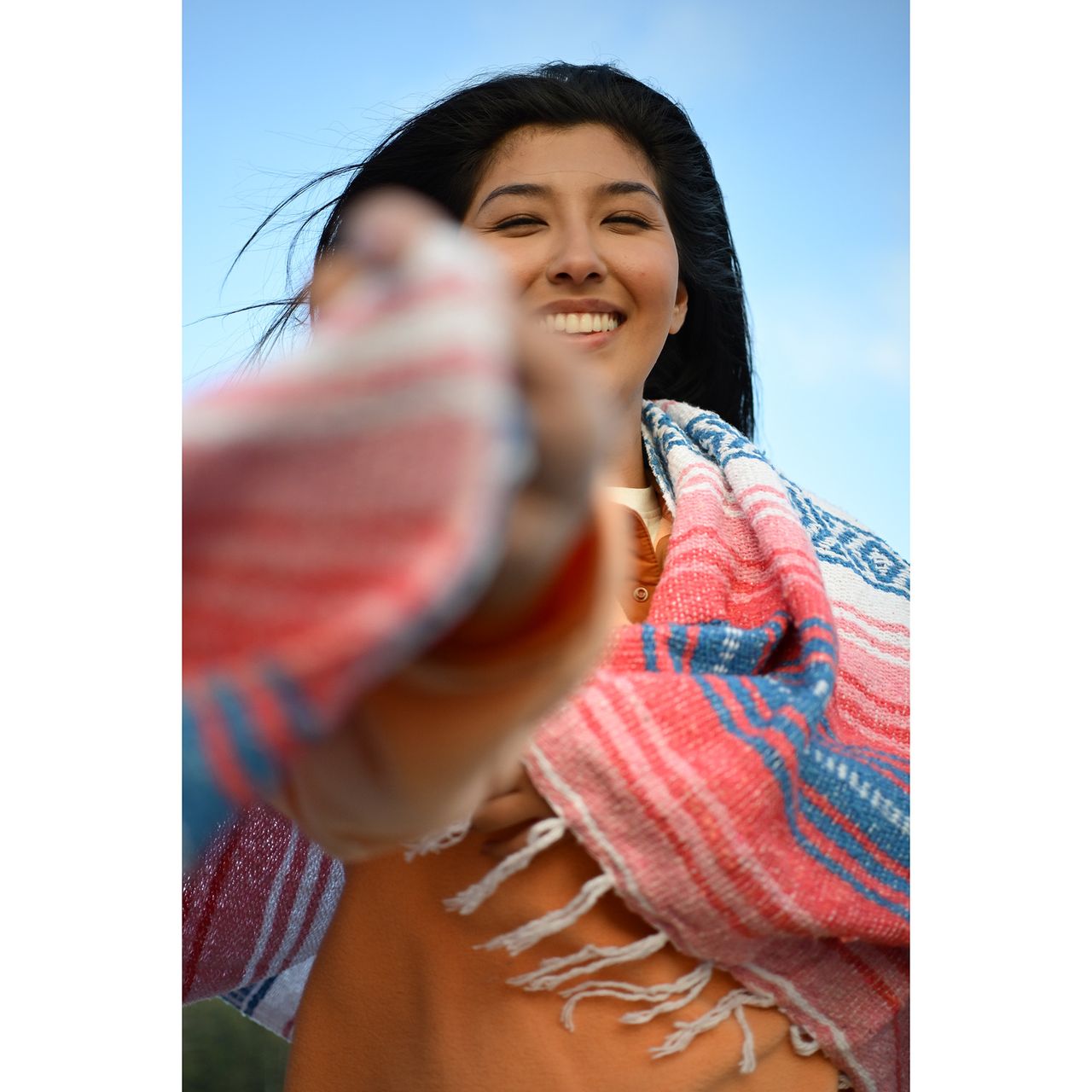 Mid-shot portrait of person smiling at camera