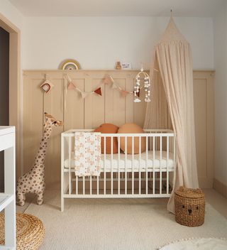 blush pink nursery with panelled walls