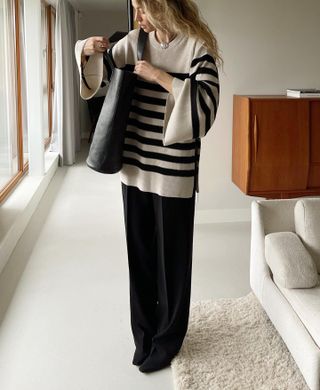 Anouk Yve 30 Striped Pieces to Buy Now and Wear Forever Oversize Striped Sweater Black Pants