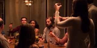 Logan Marshall Green (center) feels alone at a crowded dinner party in The Invitation