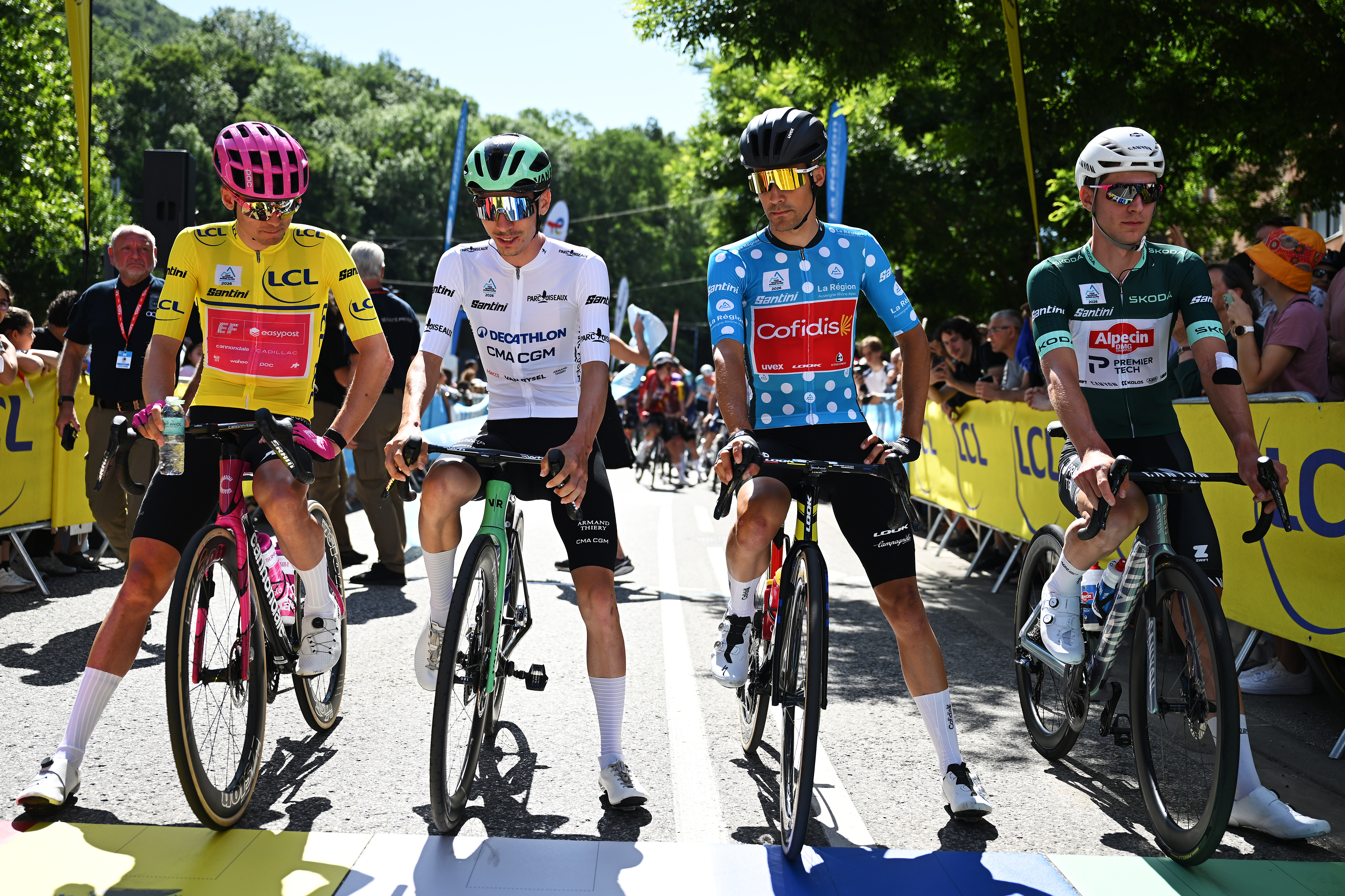 LE PUY-EN-VELAY, FRANCE - JUNE 08: (L-R) Alex Baudin of France and Team EF Education - EasyPost - Yellow Leader Jersey, Leo Bisiaux of France and Team Decathlon CMA CGM - White Best Young Rider Jersey, Sergio Samitier of Spain and Team Cofidis - Polka dot Mountain Jersey and Ramses Debruyne of Belgium and Team Alpecin-Premier Tech - Green Points Jersey prior to the 78th Tour Auvergne-Rhone-Alpes 2026, Stage 2 a 146.2km stage from Vizille to Saint-Ismier / #UCIWT / on June 08, 2026 in Le Puy-en-Velay, France. (Photo by Dario Belingheri/Getty Images)