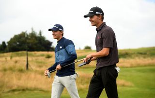 nicolai and rasmus walk up the fairway