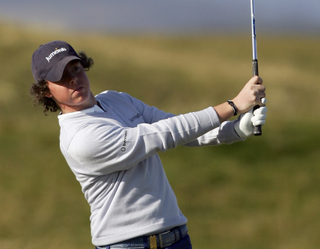 Rory McIlroy plays an iron shot in 2007