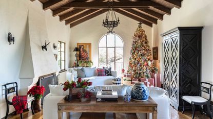 A large Spanish-style home living room with Ralph Lauren style Christmas decor