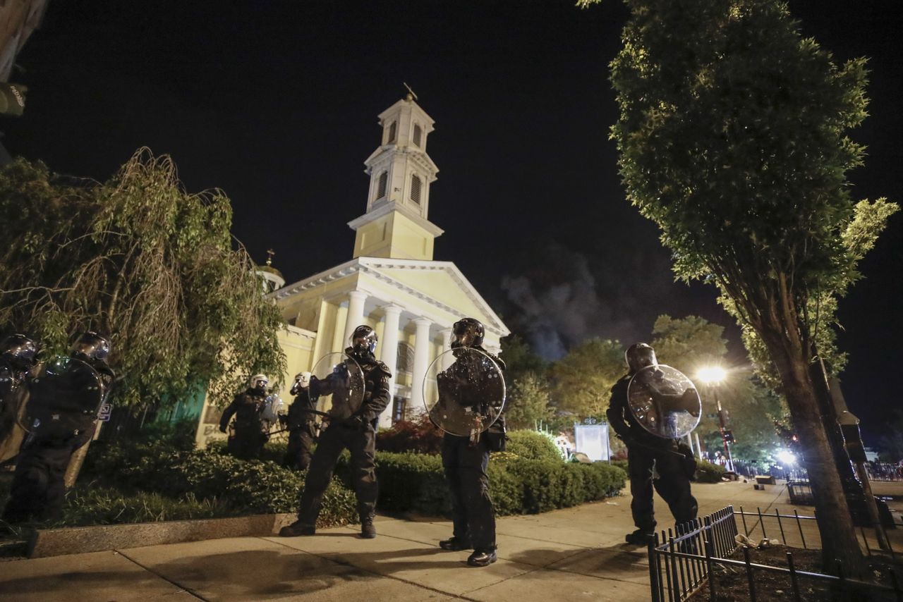 Police officers outside of St. John&amp;#039;s Church.