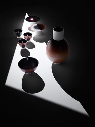 Dark brown ceramic bowls and vases
