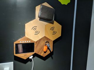 MagHive tiles include a place to store your wallet and keys, Qi wireless charging pads, and a monitor that flashes reminders. Credit: Tom's Guide