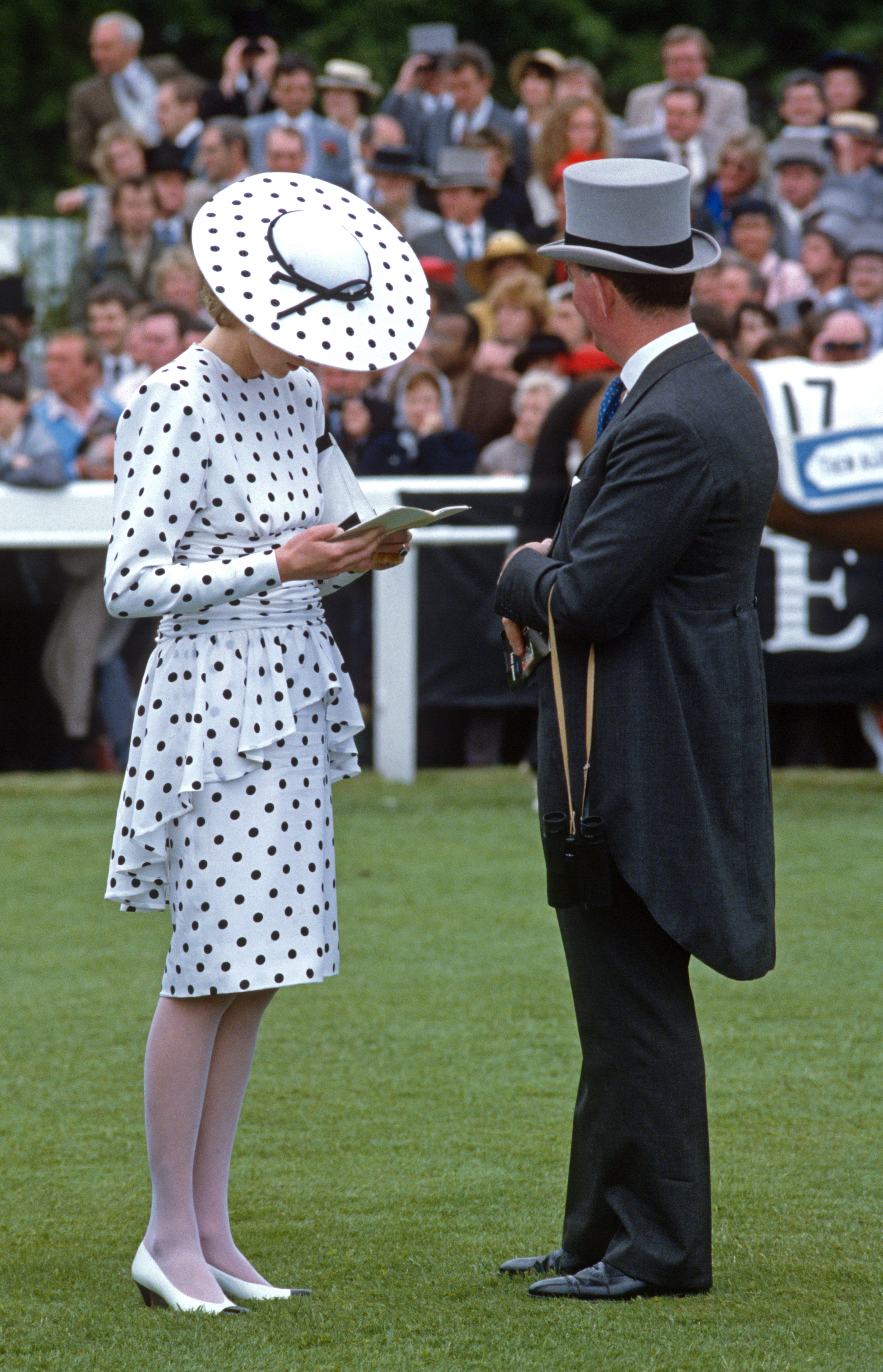 Princess Diana wearing a white and black polka dot dress and hat at Royal Ascot