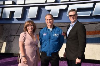 Director Angus MacLane (right) and producer Galyn Susman pose with NASA astronaut Tom Marshburn at the world premiere of the Disney and Pixar feature film "Lightyear" on June 8, 2022 at the El Capitan Theatre in Hollywood.