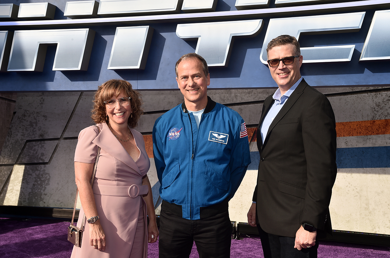 Director Angus McLain (right) and producer Galin Susman pose with NASA astronaut Tom Marshburn at the world premiere of the Disney and Pixar feature film 