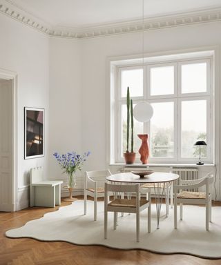 Modern European style dining room with clean lines and simple furniture