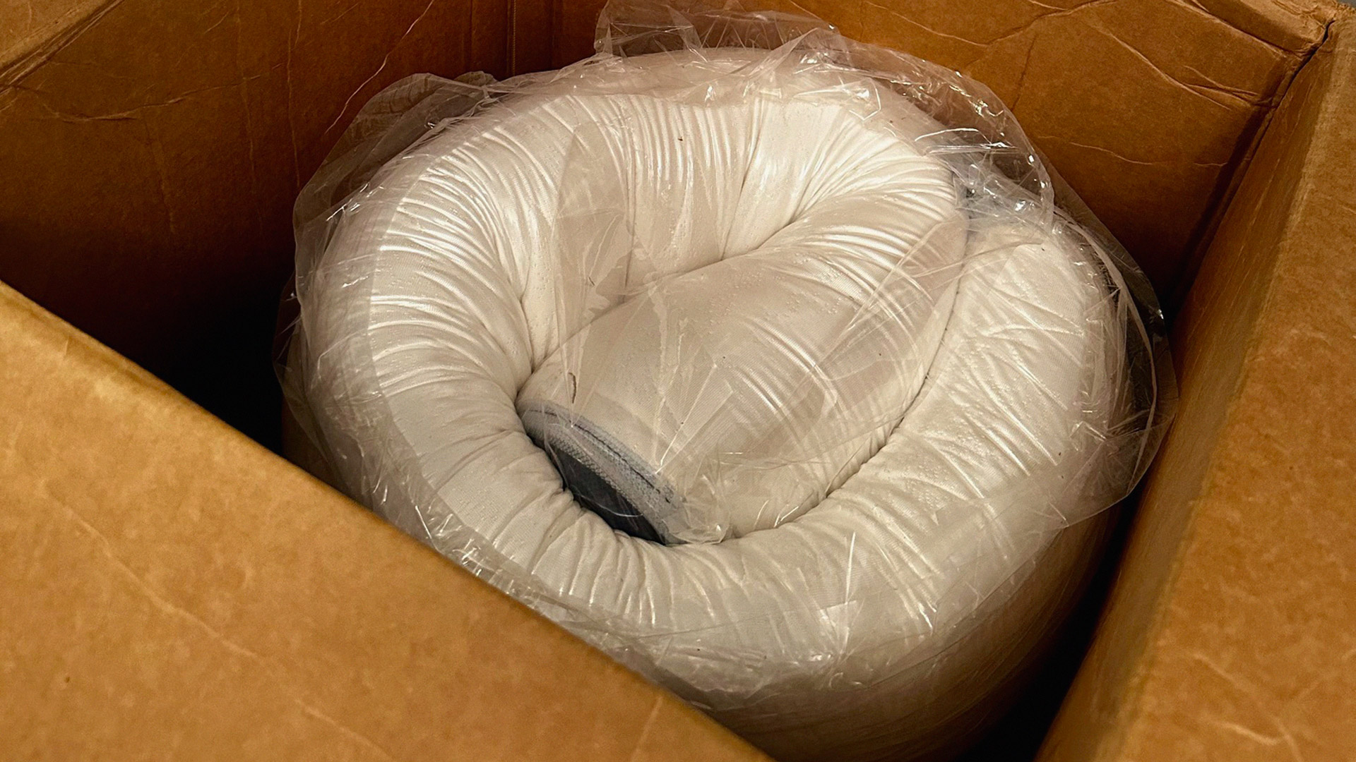 The Glacier Apex Hybrid mattress wrapped, rolled and in its box