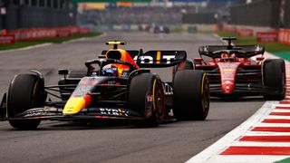 Sergio Perez of Mexico driving the (11) Oracle Red Bull Racing RB18 leads Charles Leclerc of Monaco driving (16) the Ferrari F1-75 on track during the previous F1 Grand Prix live stream